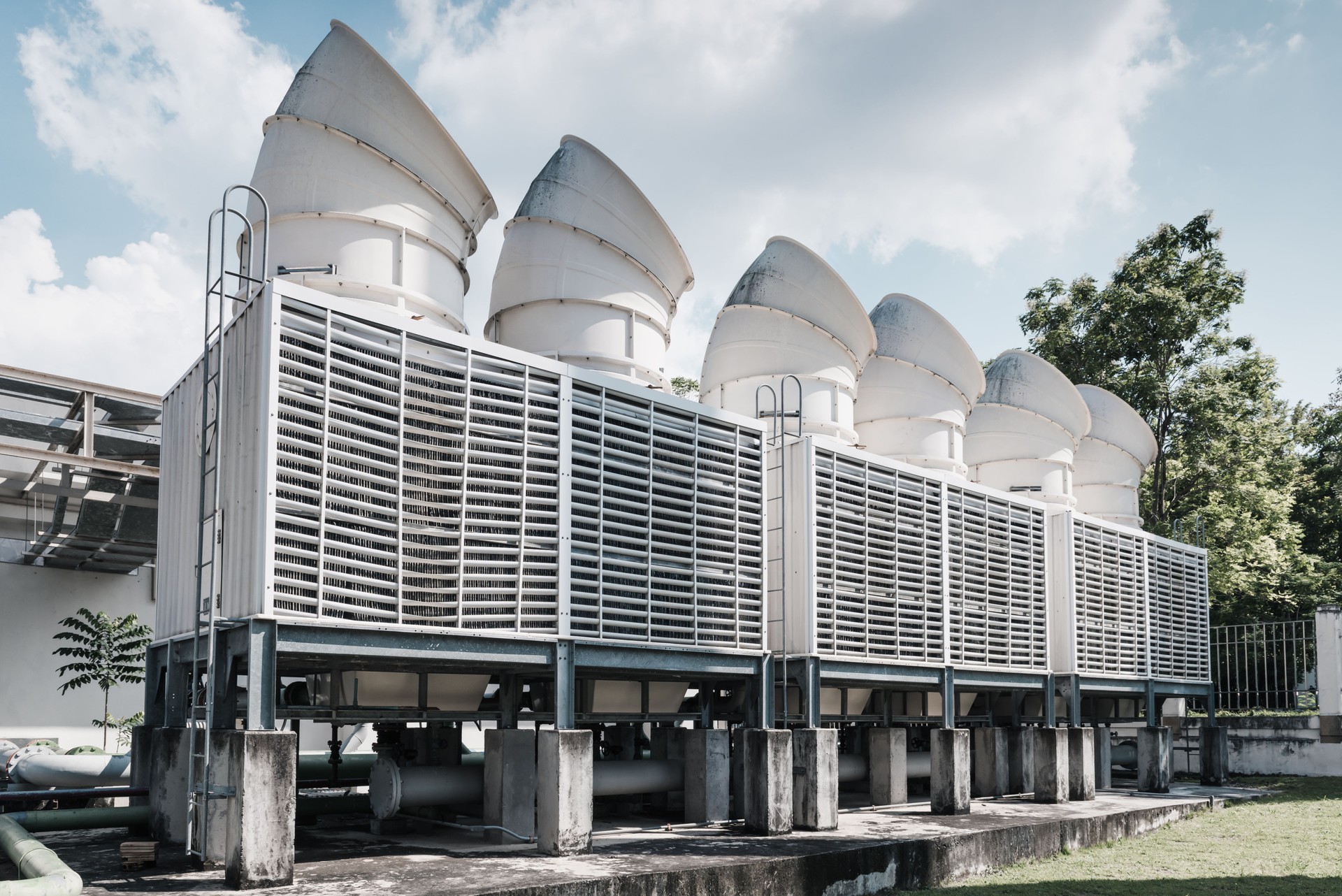Cooling Pipes System of Manufacturing Factory, Cooled Chiller Machines Tower and Pipeline Equipment of Manufacture Industry. HVAC Cooling Systems and Distribution Steel Pipping. Air Conditioning